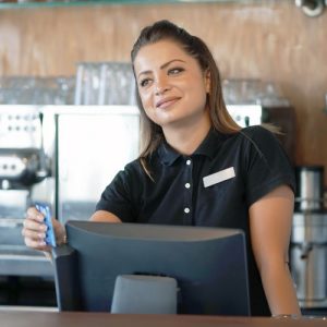 A Barmaid Registrating New Order By Cash Register. A Restaurant