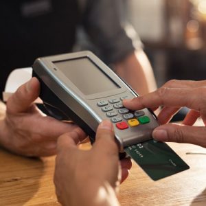 A Barmaid Registrating New Order By Cash Register. A Restaurant